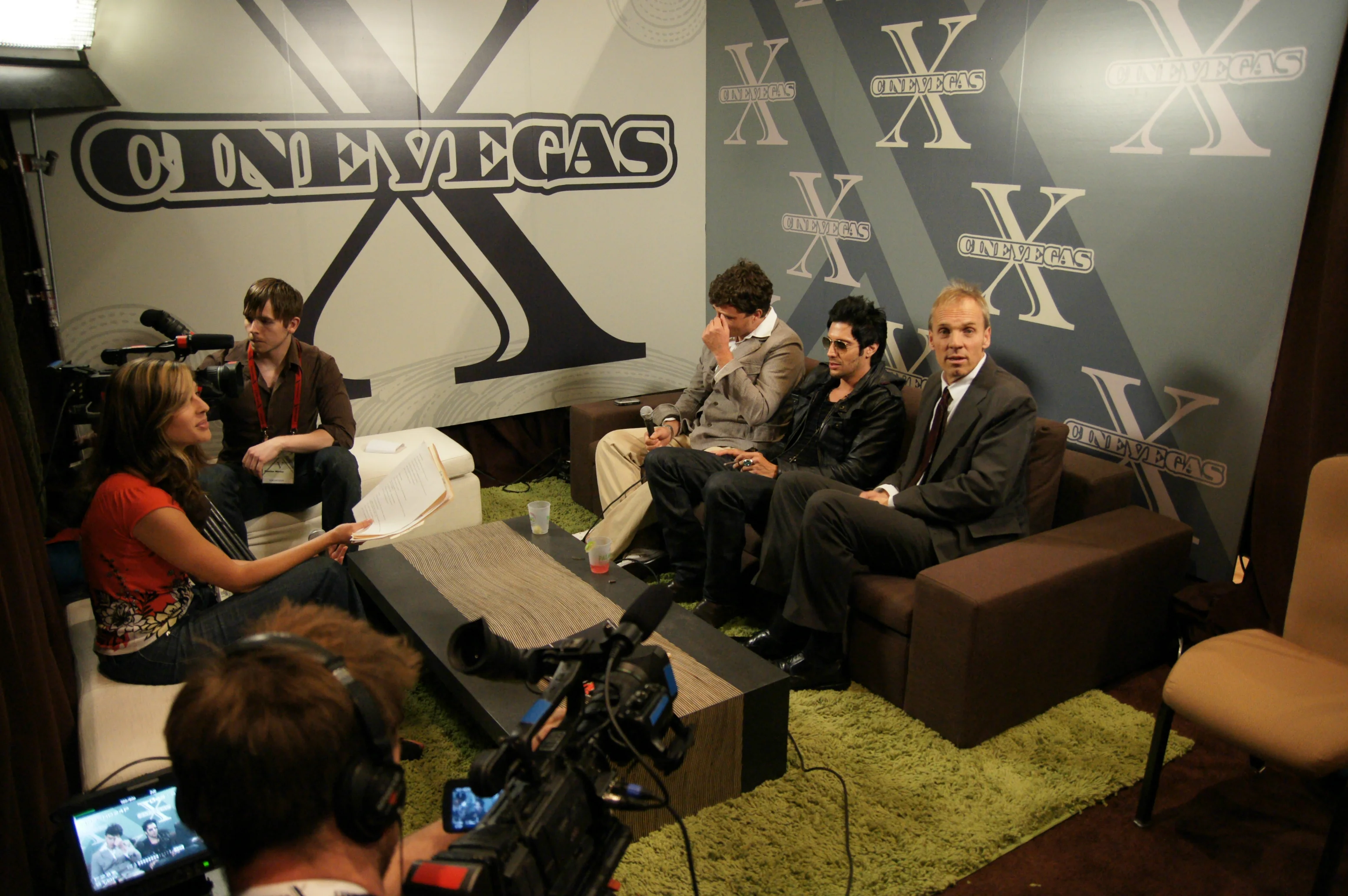 Press interview room — the CineVegas X step-and-repeat backdrop in the on-site media suite. Designed so the logo hit every camera angle.