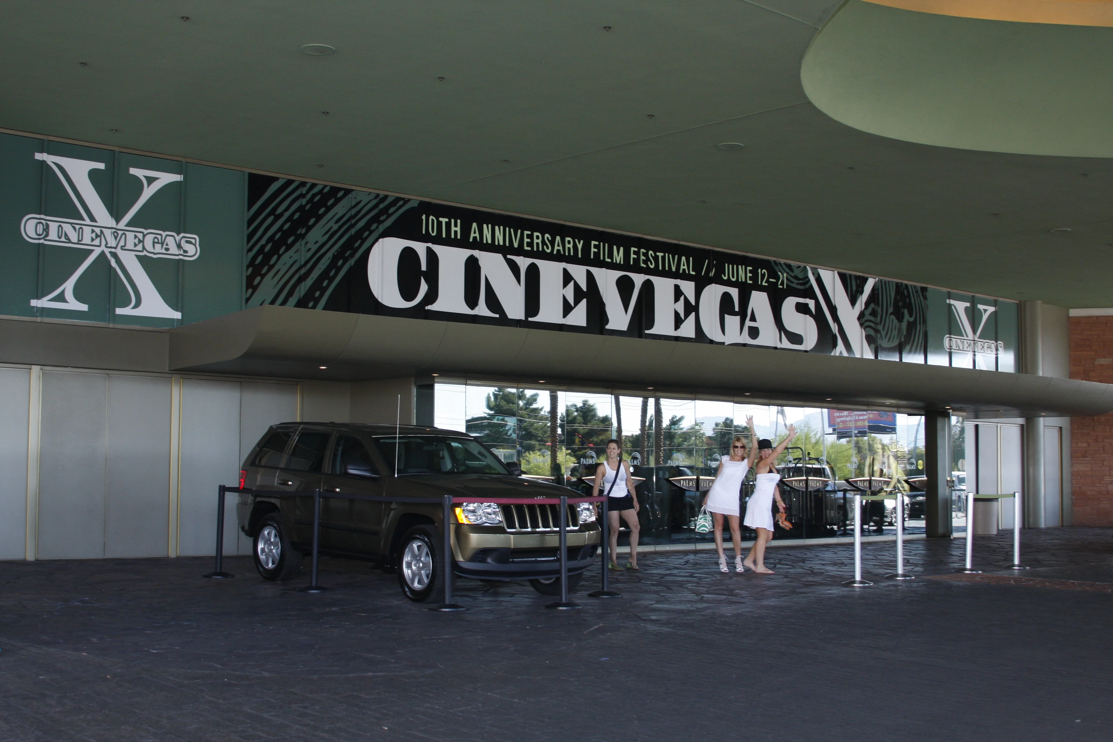Porte-cochère banner — the CineVegas X wordmark spanning the full width of the Palms Casino Resort entrance drive. June 12–21, 2008.